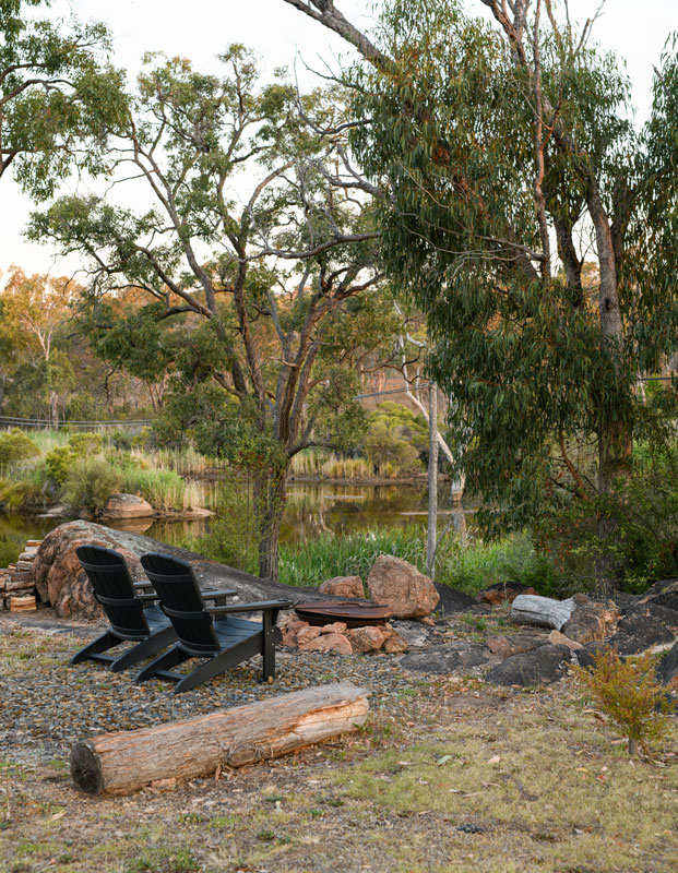 Serenita Stanthorpe Servern Glamping Tent seats outside looking over the river